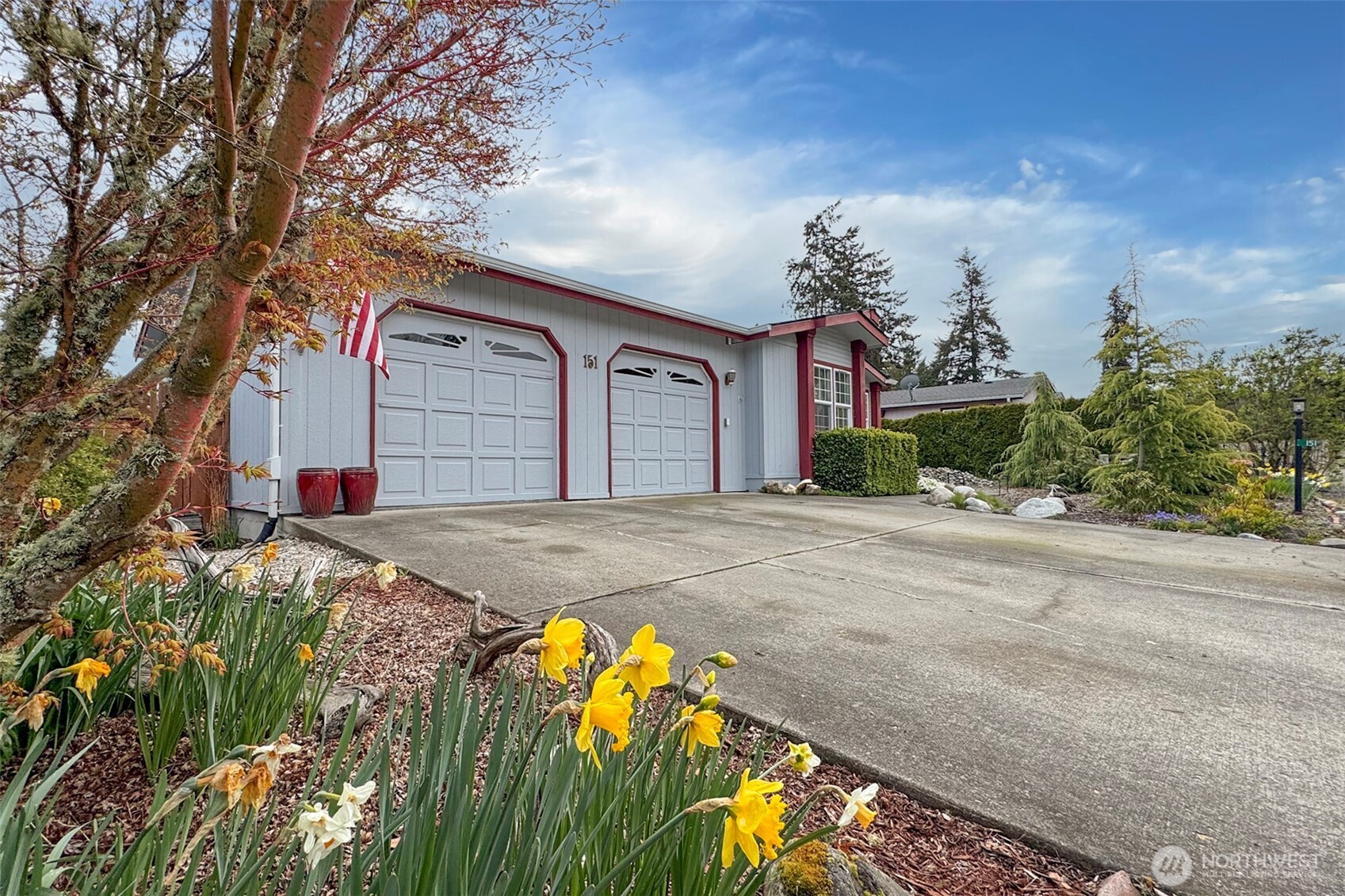 151 Green Meadows Drive Sequim, WA 98382 - Photo 2 of 40 front view of a house with a yard