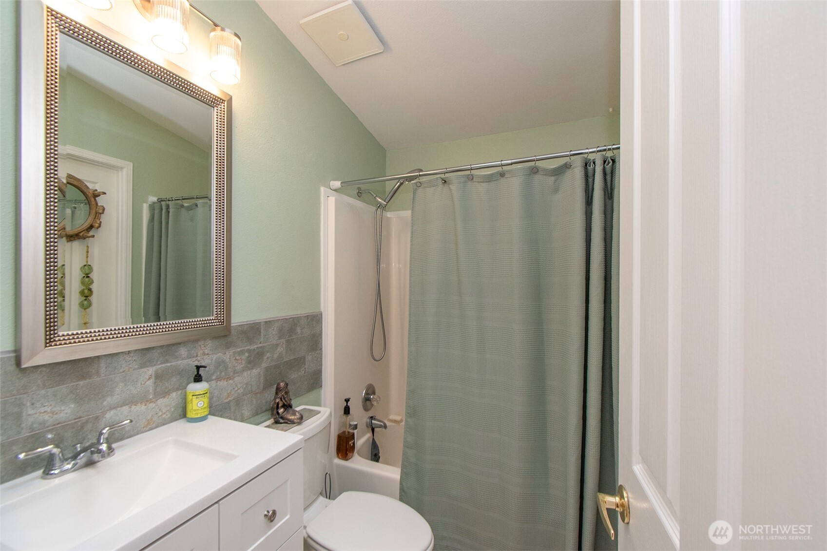 151 Green Meadows Drive Sequim, WA 98382 - Photo 24 of 40 a bathroom with a sink toilet and shower