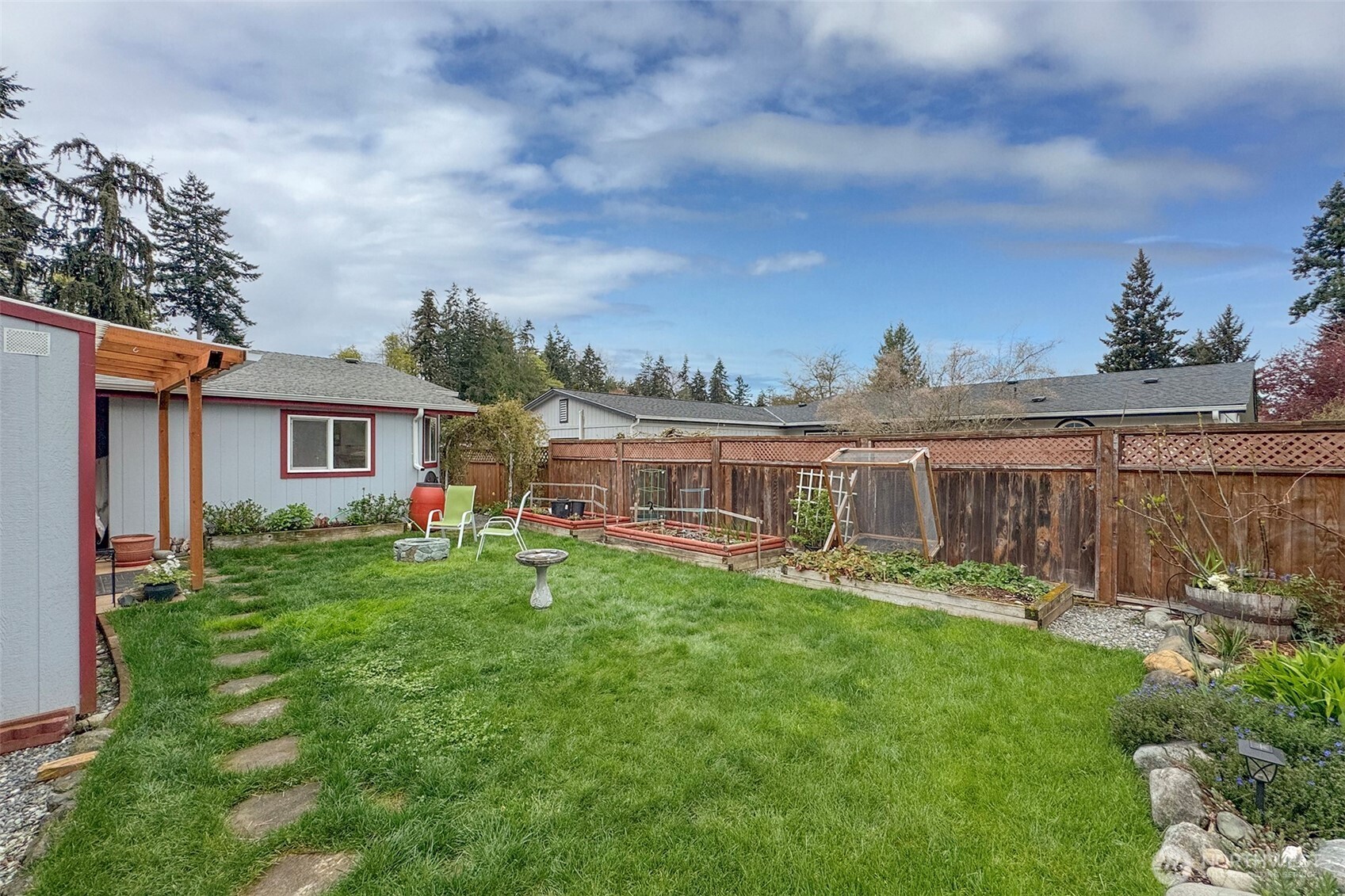 151 Green Meadows Drive Sequim, WA 98382 - Photo 39 of 40 a view of a house with backyard and porch