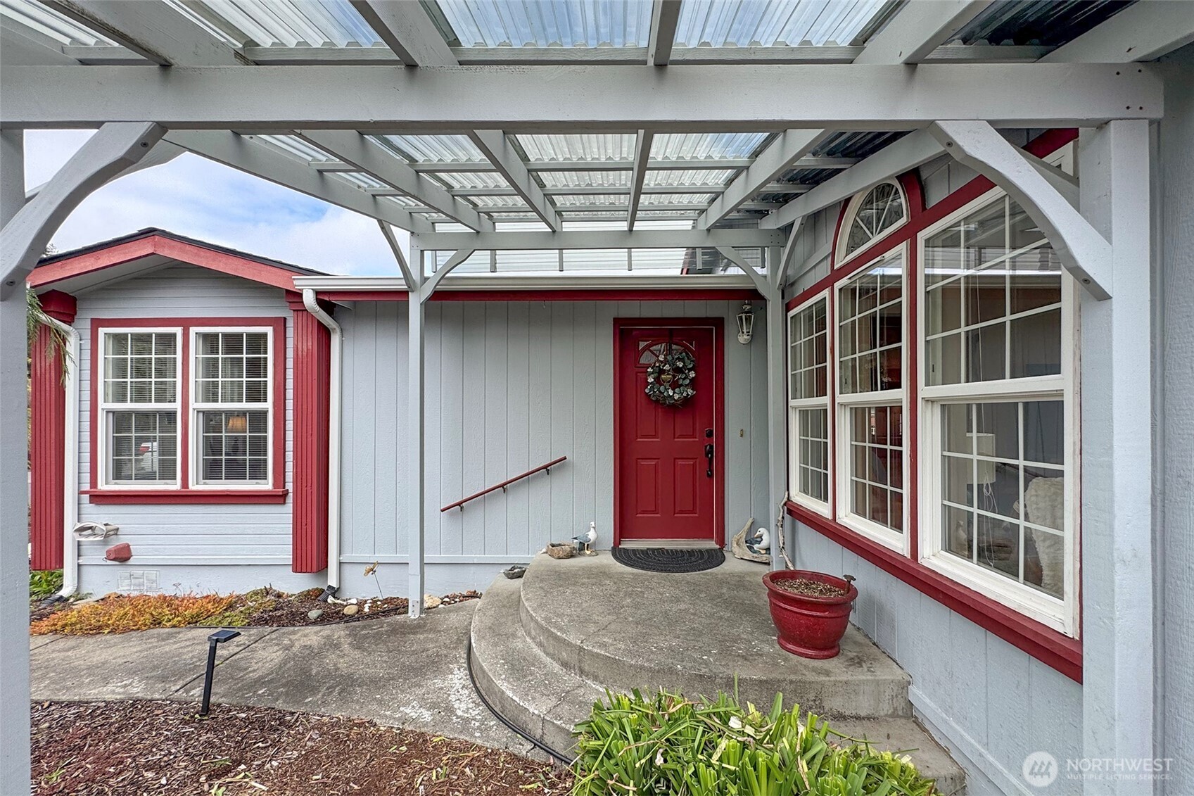 151 Green Meadows Drive Sequim, WA 98382 - Photo 5 of 40 a front view of a house with a porch