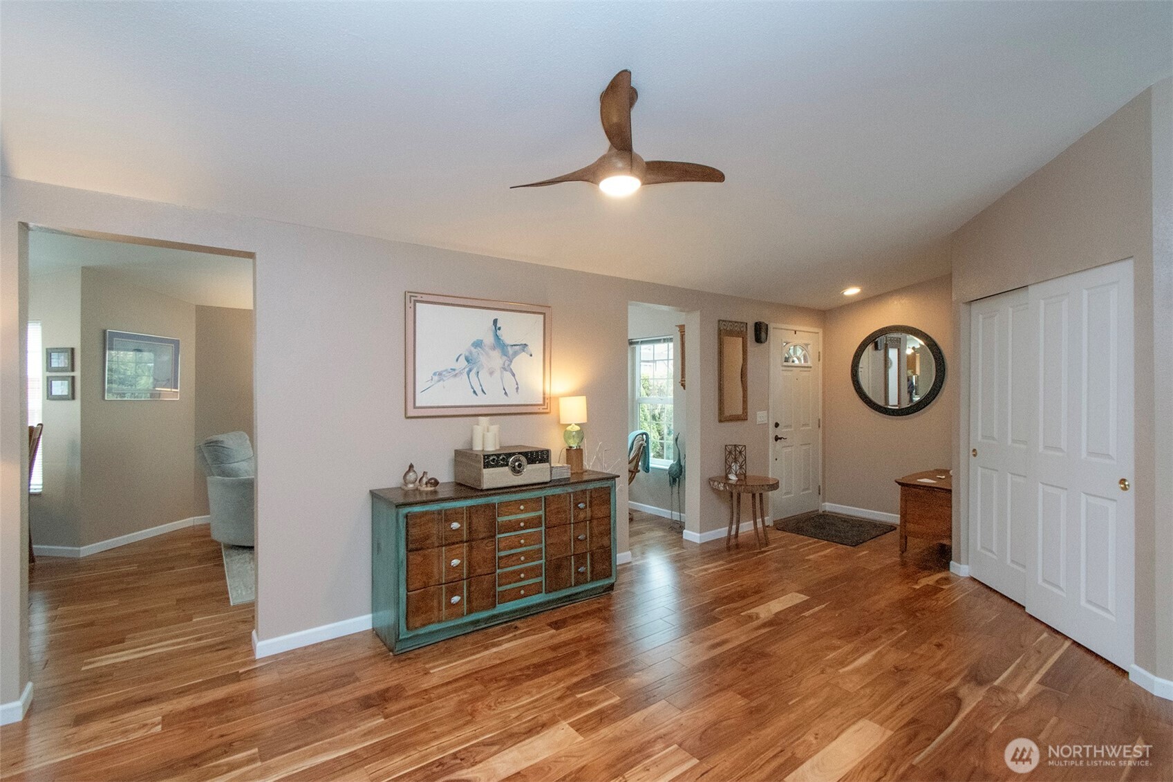 151 Green Meadows Drive Sequim, WA 98382 - Photo 10 of 40 a living room with furniture and a wooden floor