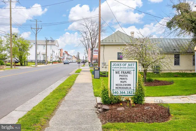 a view of a street with a sign on the side of it
