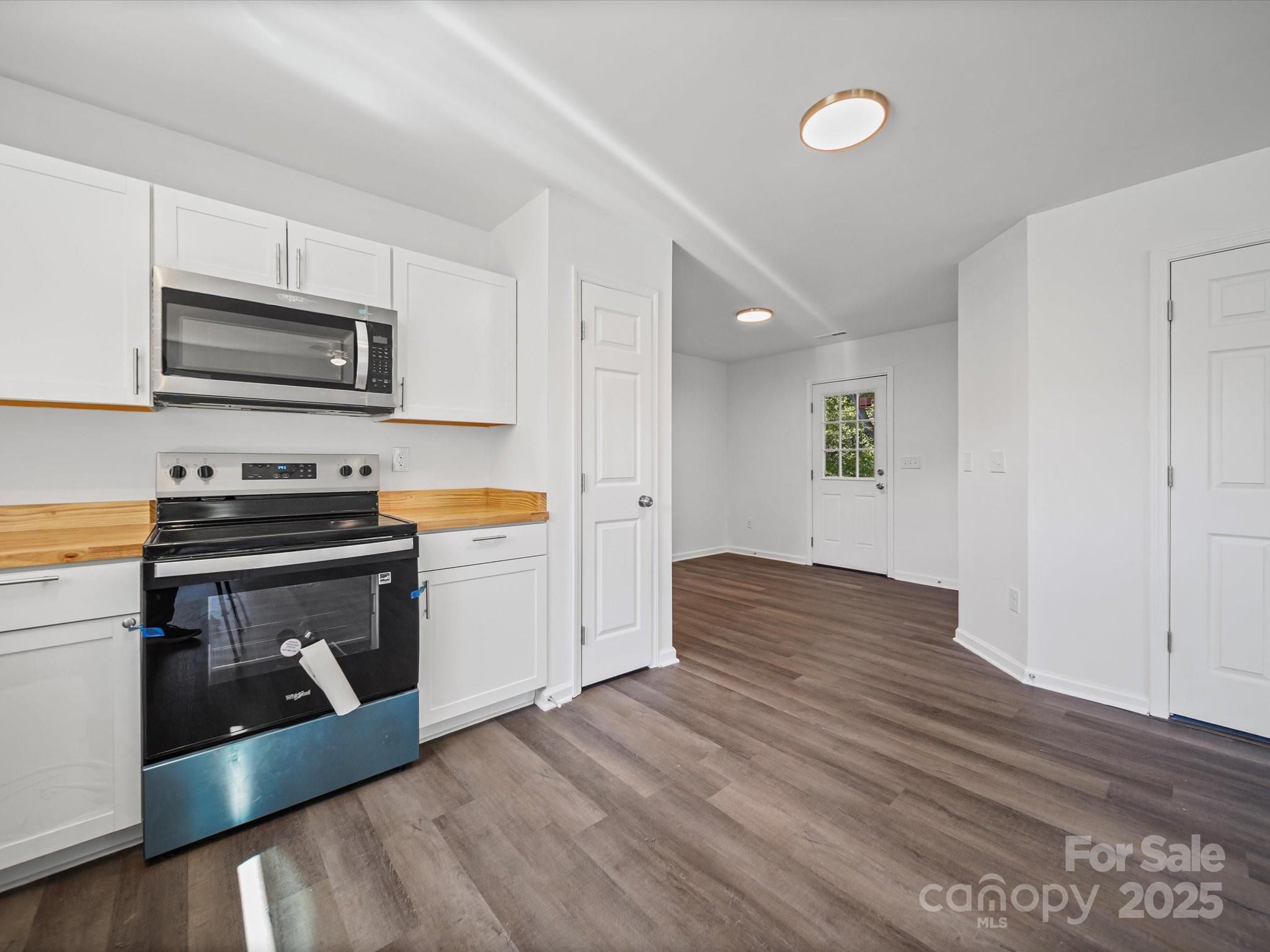 185 West End Street Chester, SC 29706 - Photo 11 of 26 a kitchen with stainless steel appliances granite countertop a stove a sink and a microwave