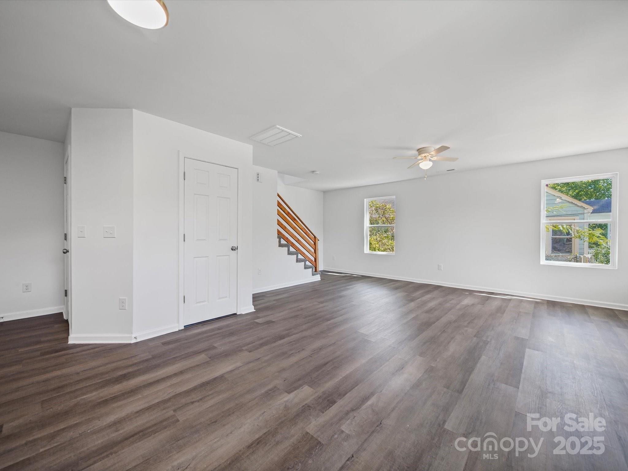 185 West End Street Chester, SC 29706 - Photo 12 of 26 an empty room with wooden floor and windows