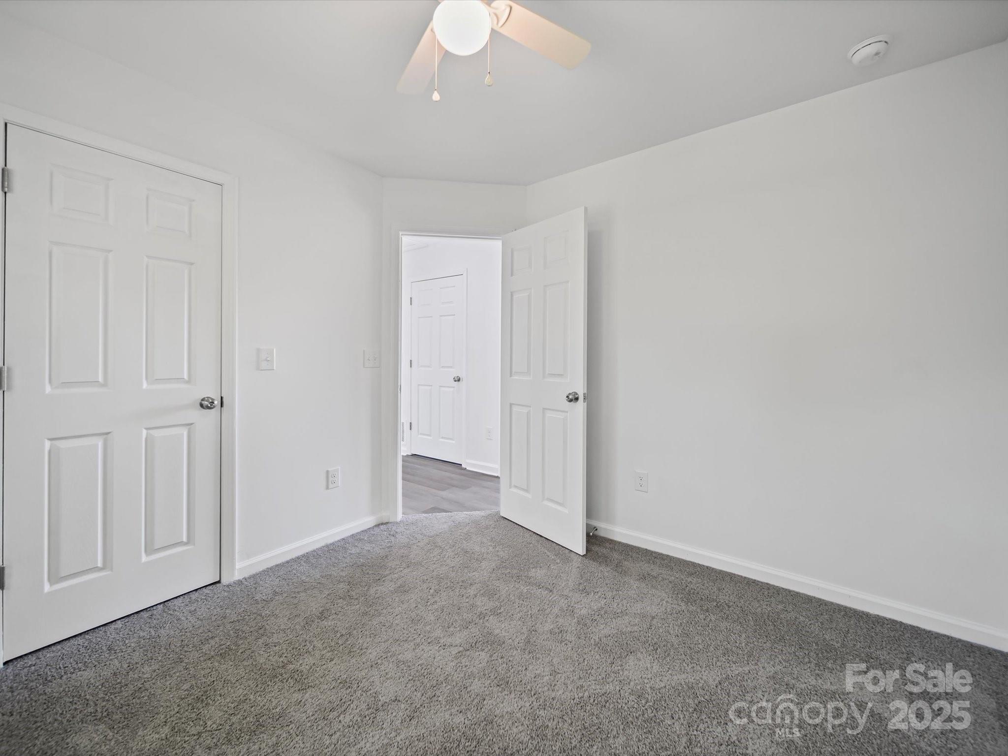 185 West End Street Chester, SC 29706 - Photo 19 of 26 a view of an empty room and a chandelier fan