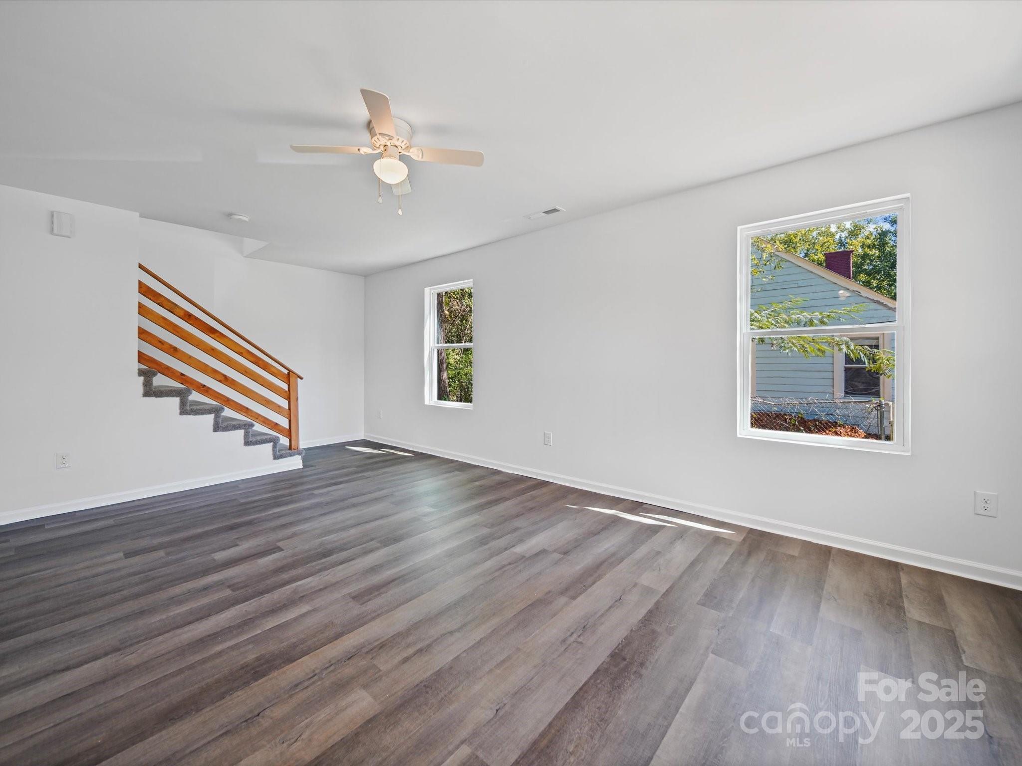 185 West End Street Chester, SC 29706 - Photo 8 of 26 a view of an empty room with wooden floor and a window