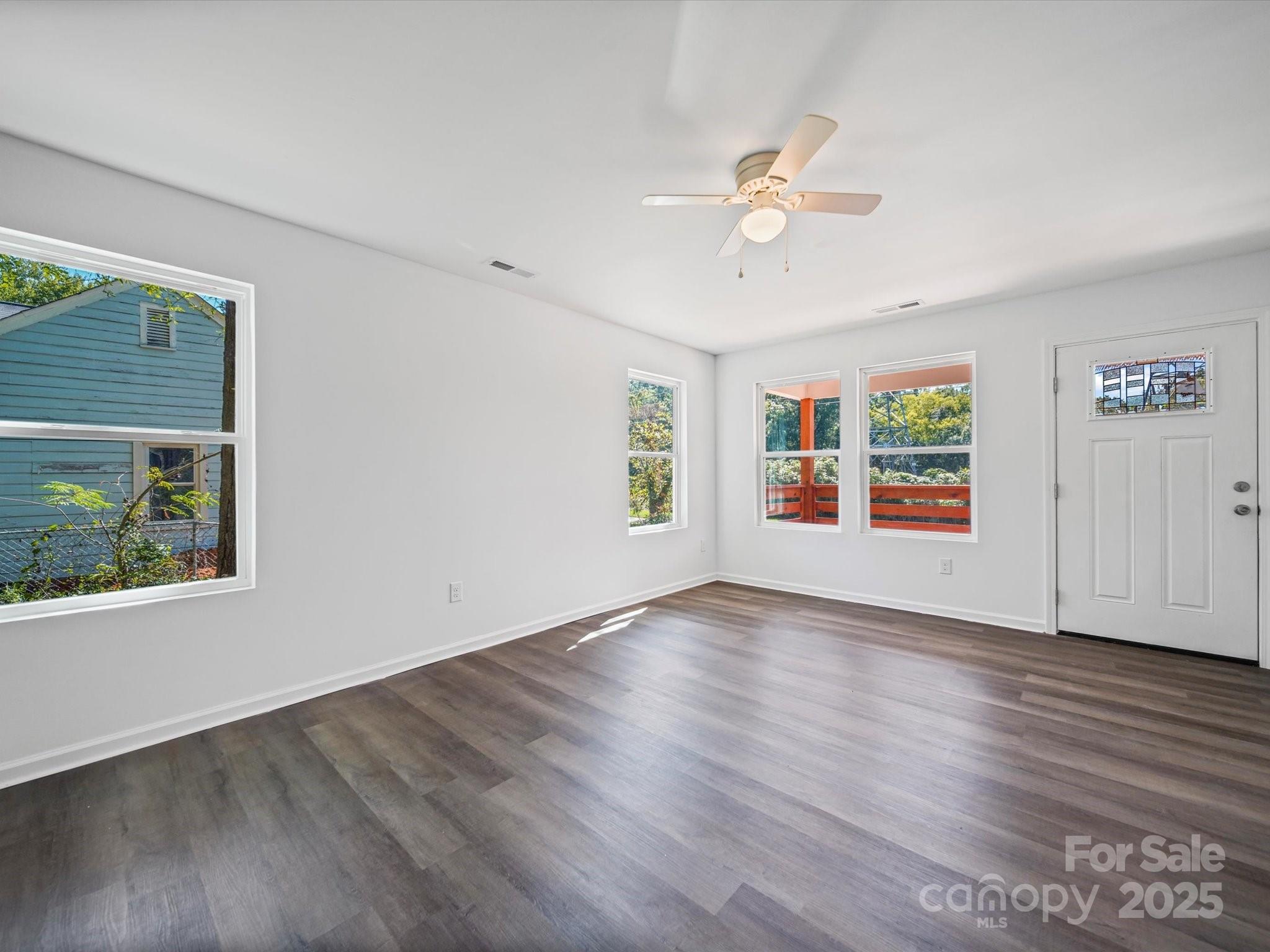 185 West End Street Chester, SC 29706 - Photo 9 of 26 a view of an empty room with wooden floor and a window