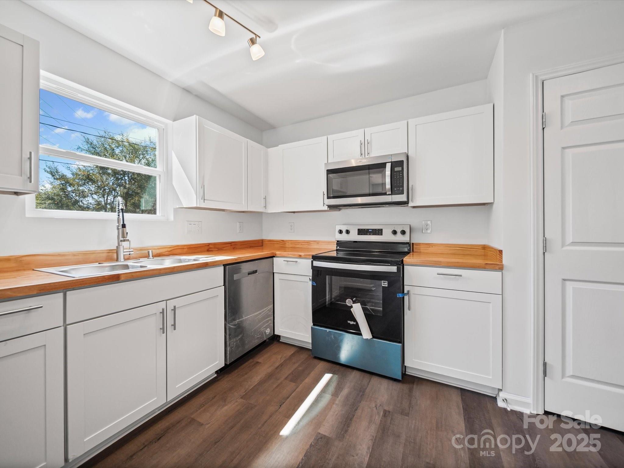 185 West End Street Chester, SC 29706 - Photo 10 of 26 a kitchen with stainless steel appliances a stove a sink and a refrigerator