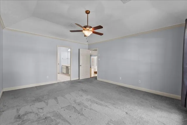 a bathroom with a granite countertop sink a mirror and a shower