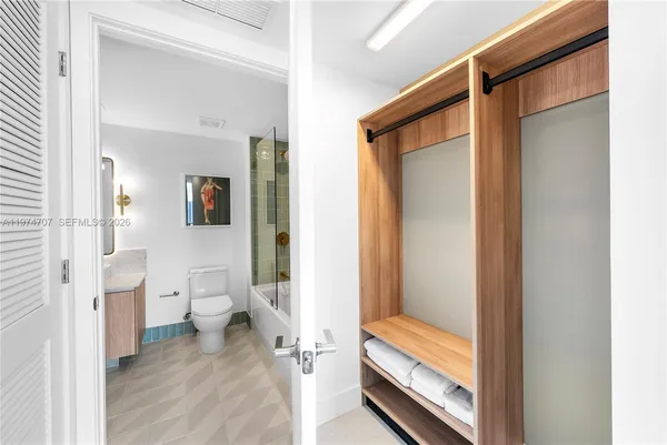 a bathroom with a glass shower door