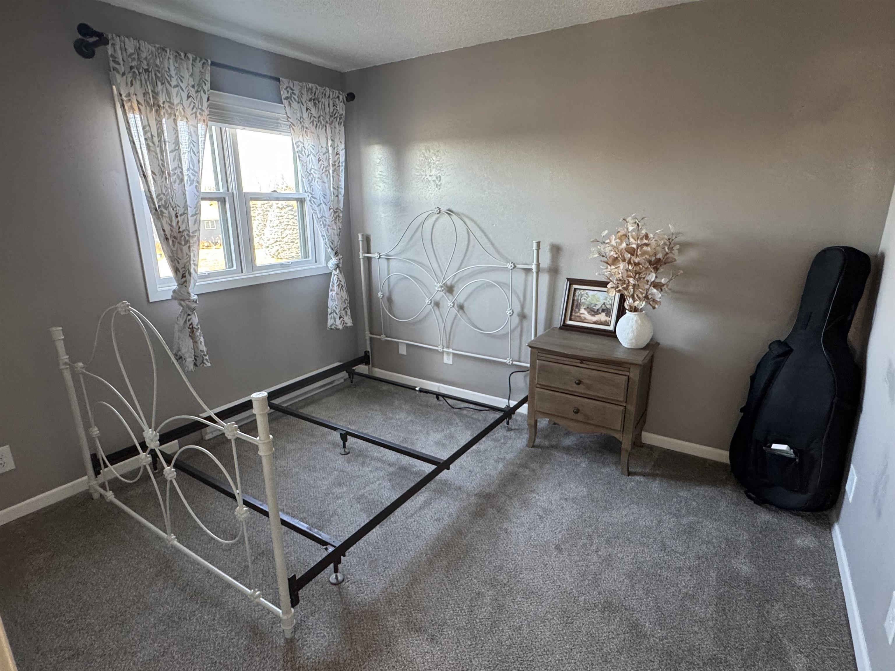 1217 North 33rd Street Superior, WI 54880 - Photo 16 of 21 Carpeted bedroom with a textured ceiling and baseboards