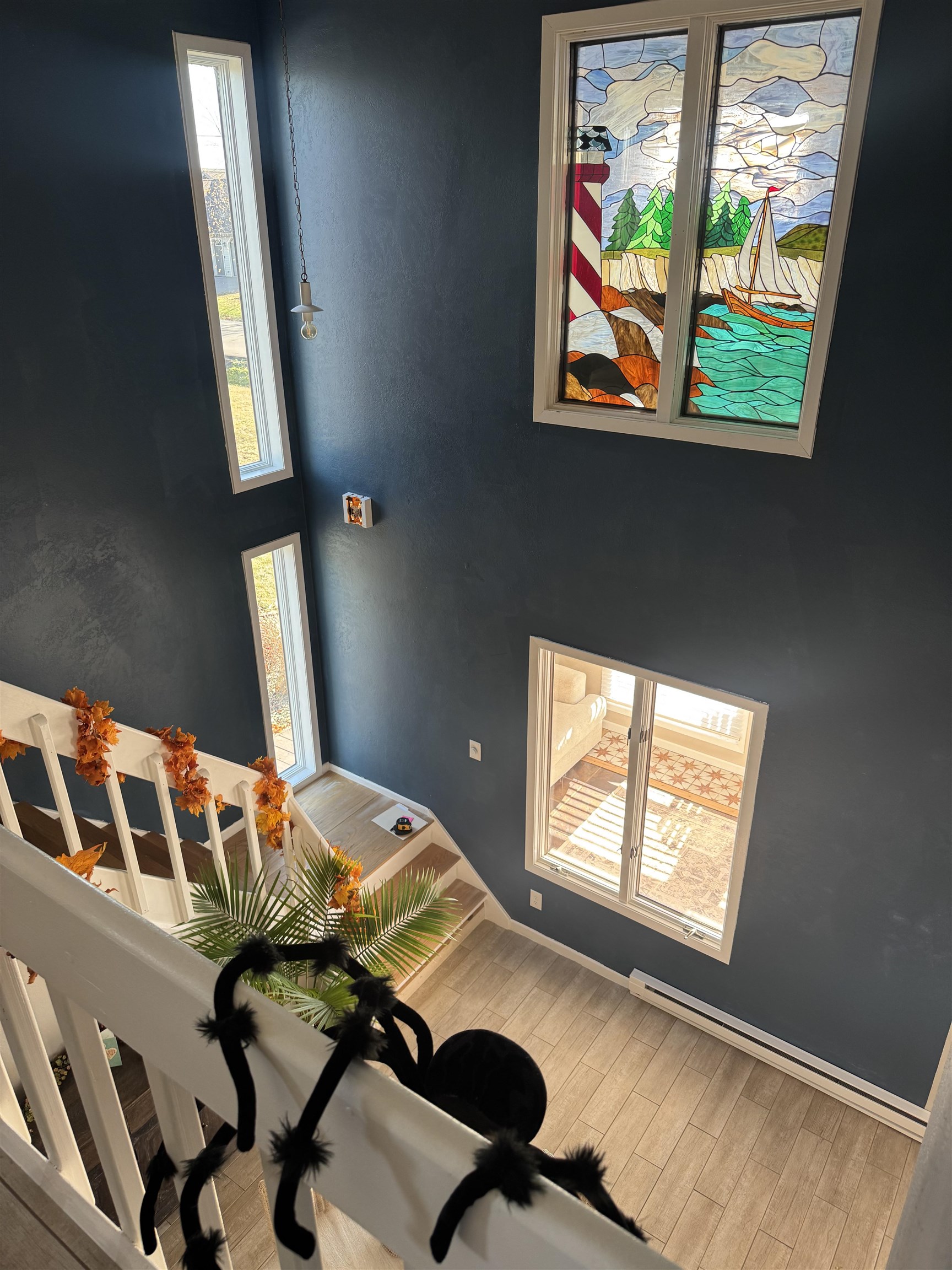 1217 North 33rd Street Superior, WI 54880 - Photo 20 of 21 Foyer entrance with baseboard heating, a towering ceiling, and wood finished floors