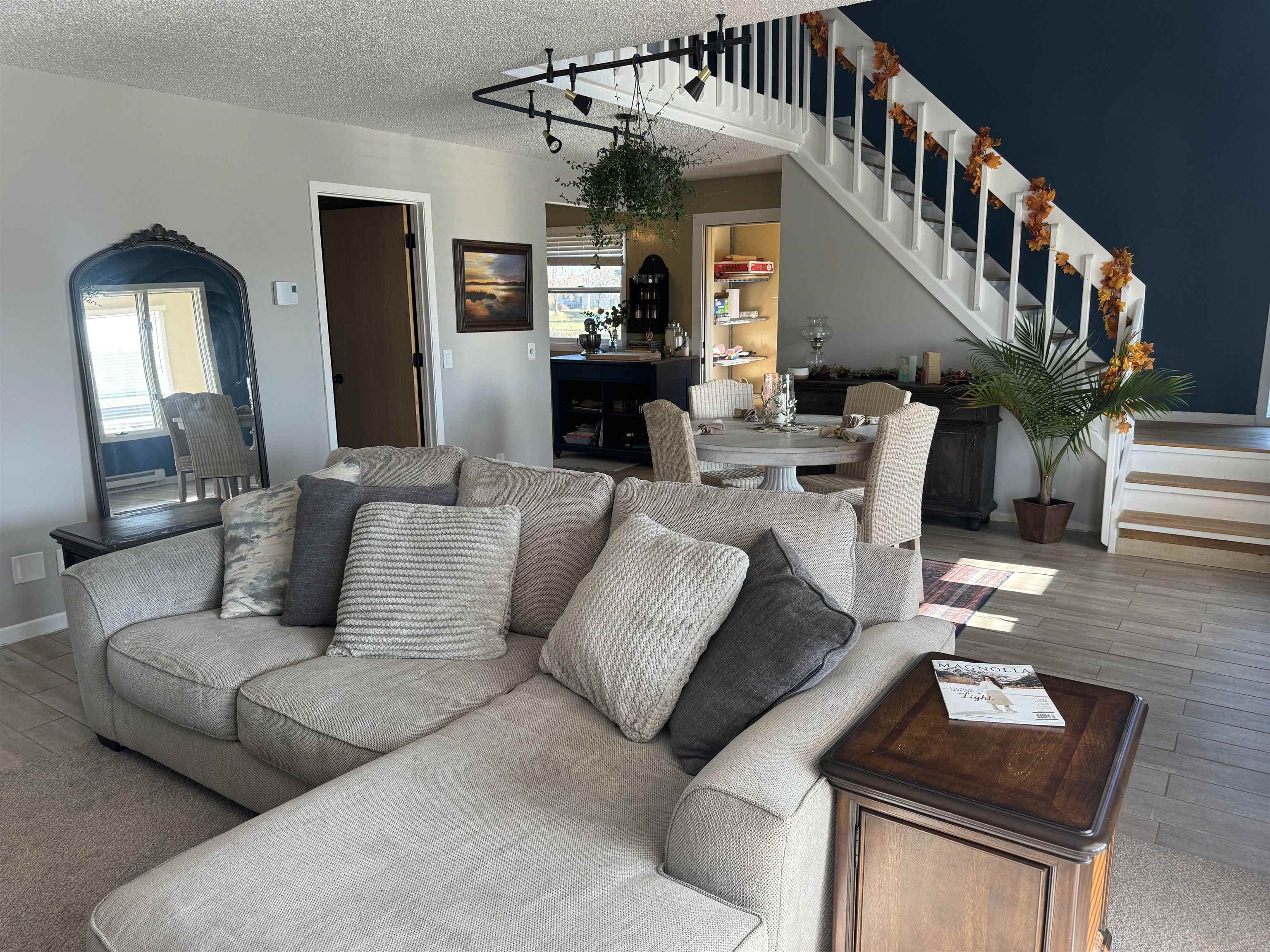 1217 North 33rd Street Superior, WI 54880 - Photo 6 of 21 Living area with stairs, a textured ceiling, wood finished floors, and arched walkways