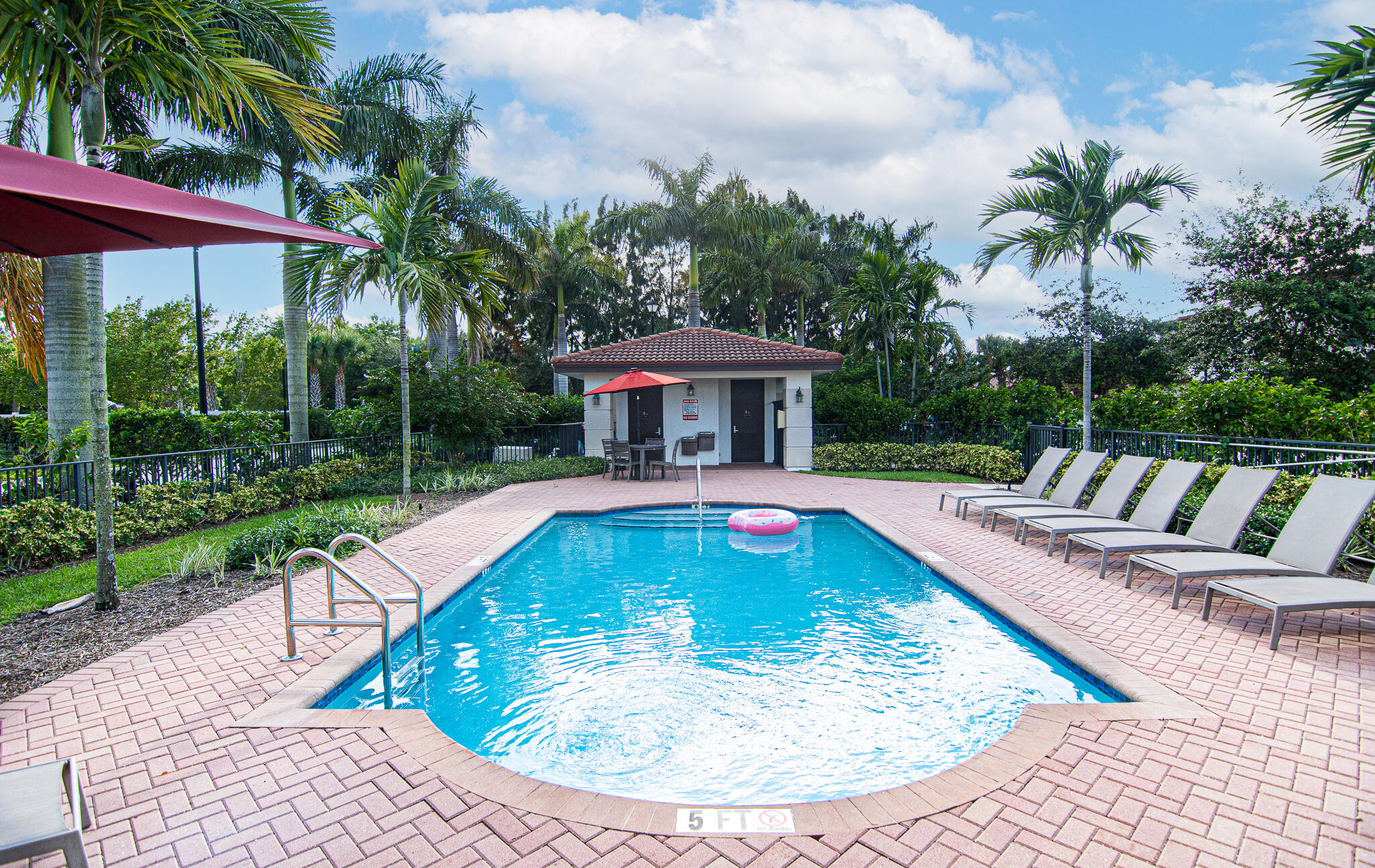 14426 Emerald Pl Way Delray Beach, FL 33484 - Photo 2 of 15 a view of a swimming pool with a patio