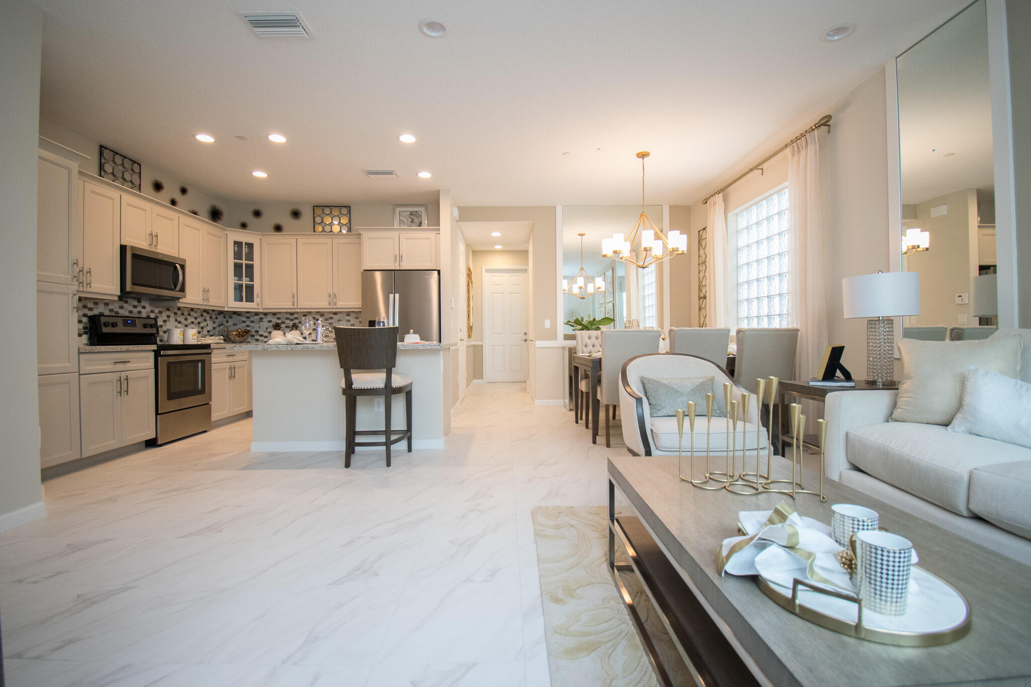 14426 Emerald Pl Way Delray Beach, FL 33484 - Photo 5 of 15 a living room with furniture kitchen and a kitchen island