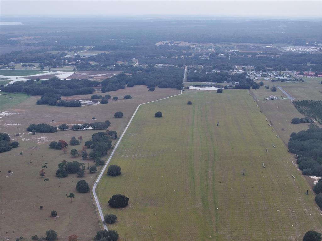 26049 Fair Street Astatula, FL 34705 - Photo 9 of 21 an aerial view of a house