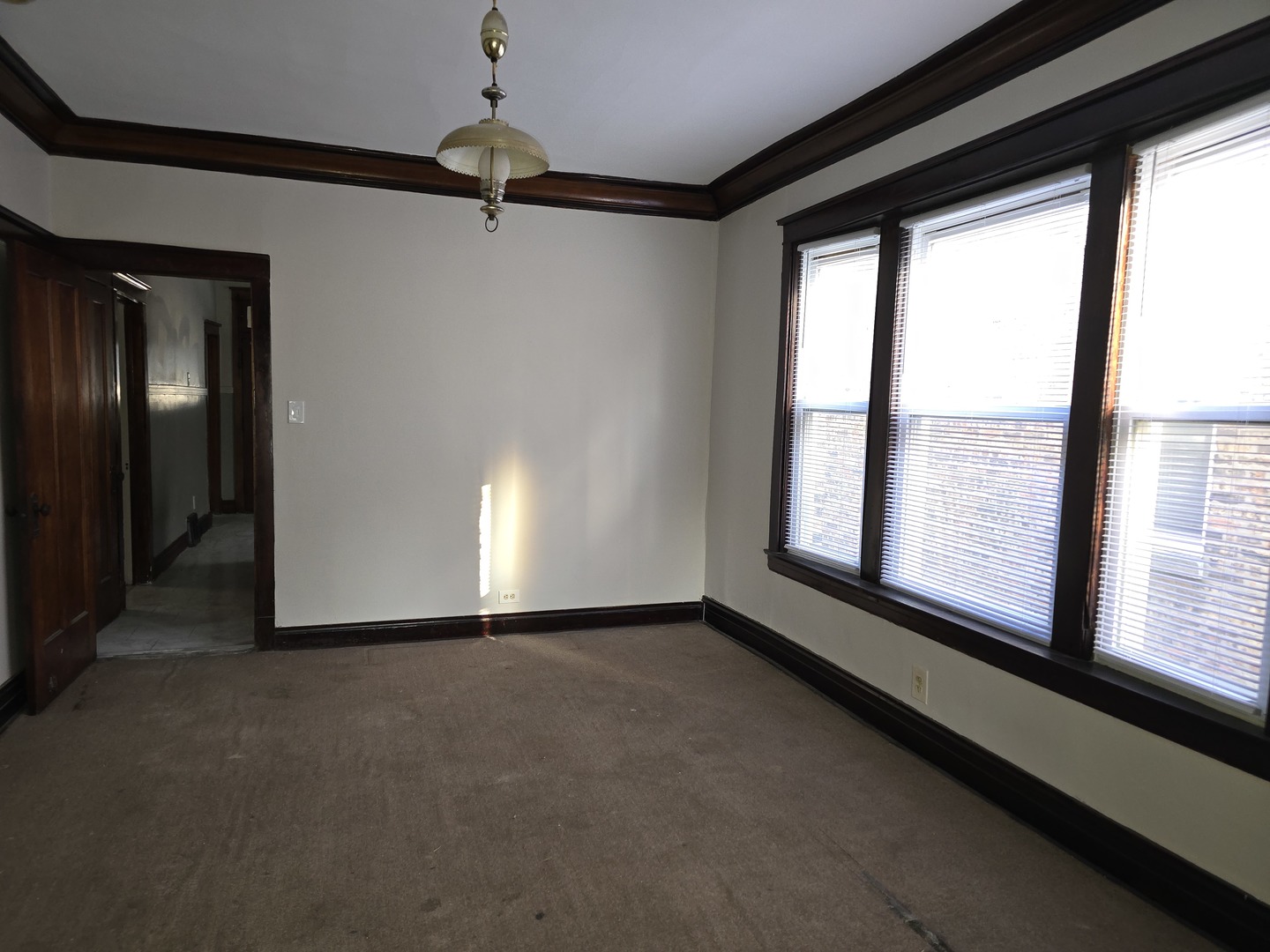 7517 South Green Street Chicago, IL 60620 - Photo 7 of 22 a view of an empty room with a window