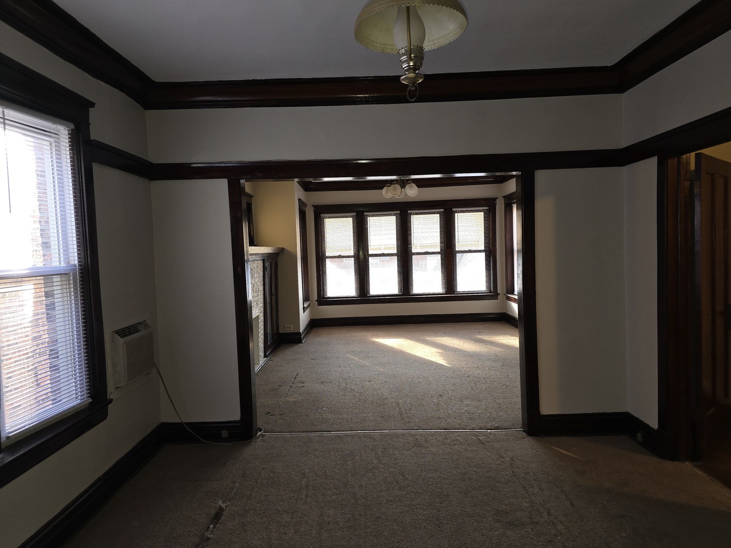 7517 South Green Street Chicago, IL 60620 - Photo 10 of 22 a view of an empty room with a window