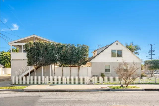 a view of a house with a backyard and a garage