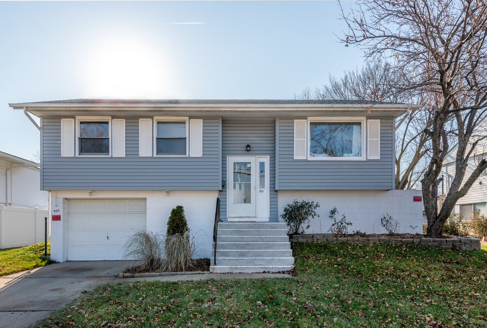623 West Romeo Road Romeoville, IL 60446 - Photo 1 of 19 a front view of a house with garden