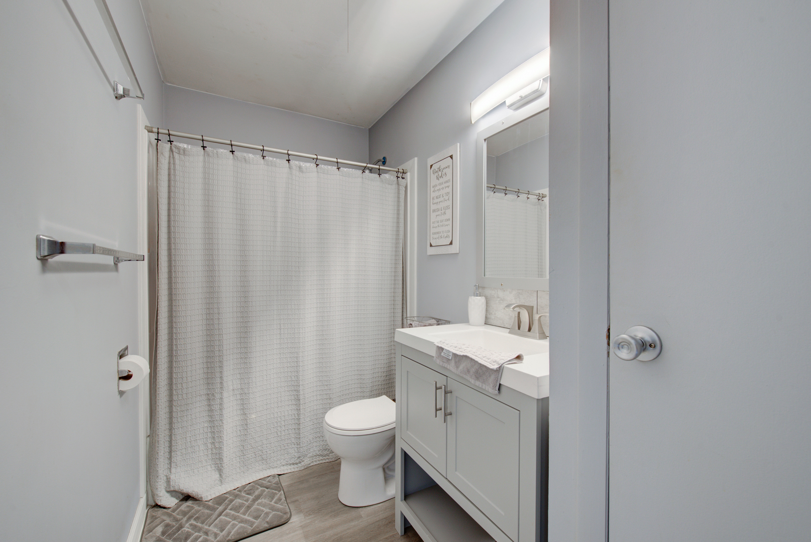 623 West Romeo Road Romeoville, IL 60446 - Photo 11 of 19 a bathroom with a toilet a sink and shower