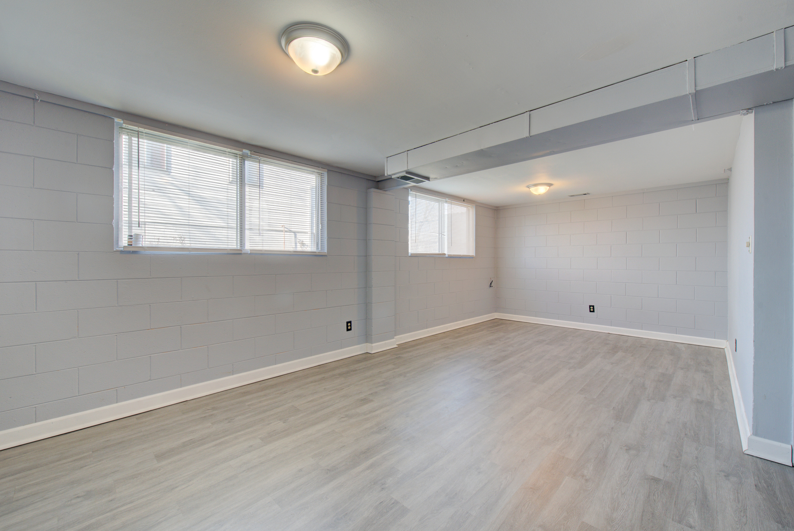 623 West Romeo Road Romeoville, IL 60446 - Photo 16 of 19 an empty room with wooden floor and windows
