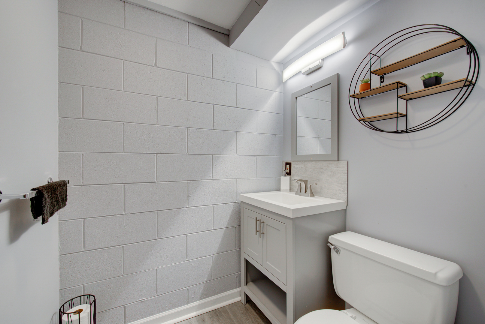 623 West Romeo Road Romeoville, IL 60446 - Photo 19 of 19 a bathroom with a toilet a sink and mirror