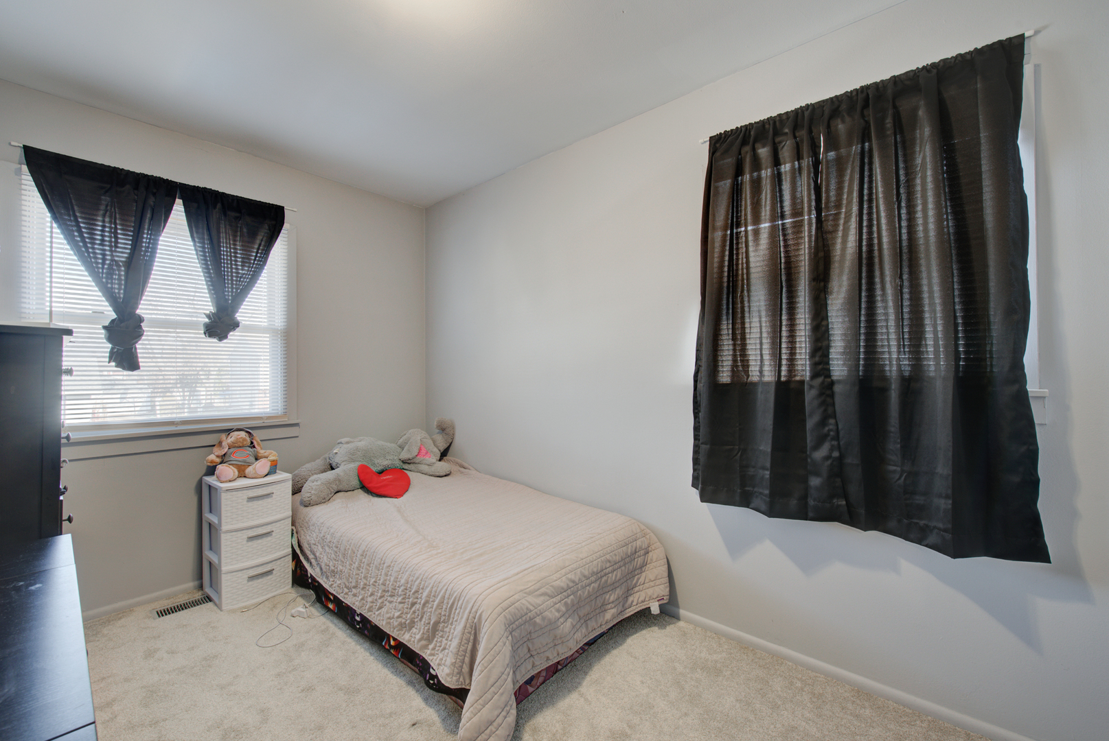 623 West Romeo Road Romeoville, IL 60446 - Photo 10 of 19 a bedroom with a bed and a window