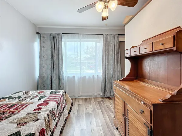a bedroom with a stove and a window