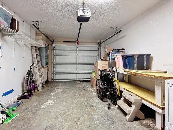 a view of gym equipment with clothes and shoes