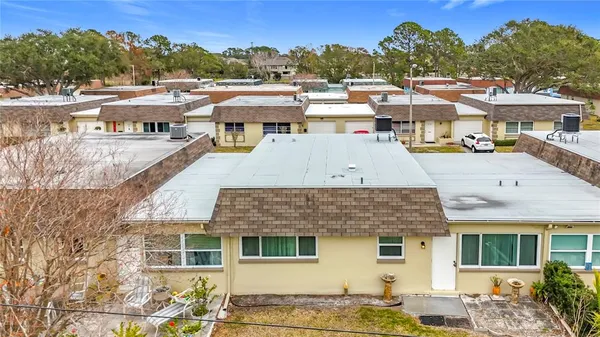 a aerial view of a house with a swimming pool