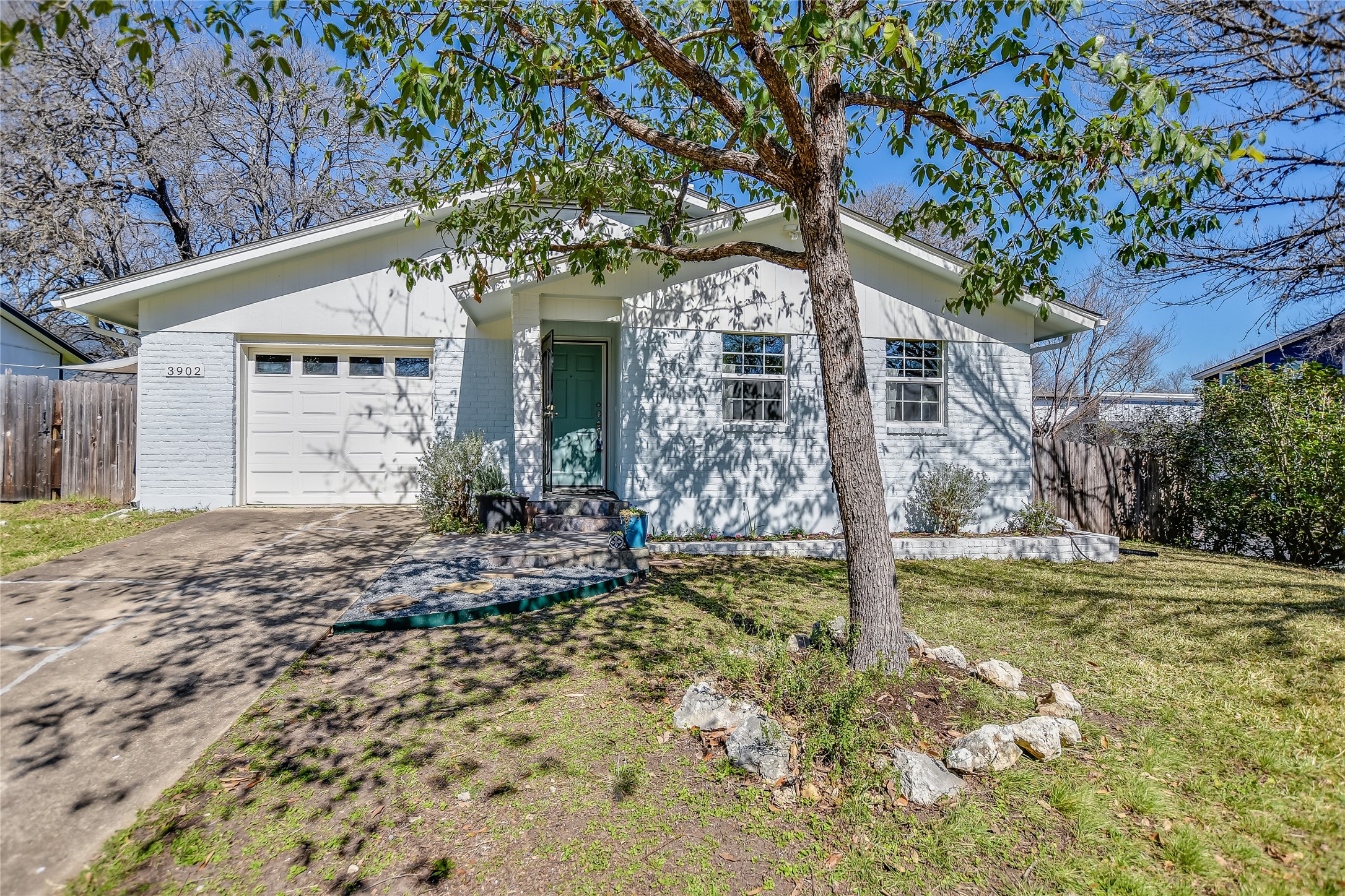 3902 East 16th Street Austin, TX 78721 - Photo 1 of 1 Front exterior. New roof and gutters! Recent exterior paint. 1-car attached garage! Large corner lot with trees.