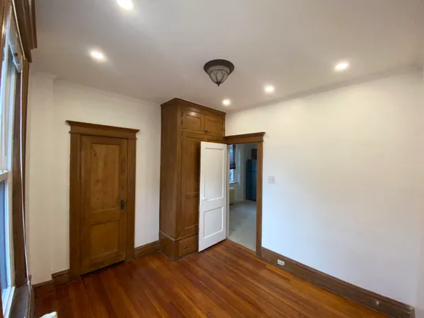 a view of hallway with wooden floor