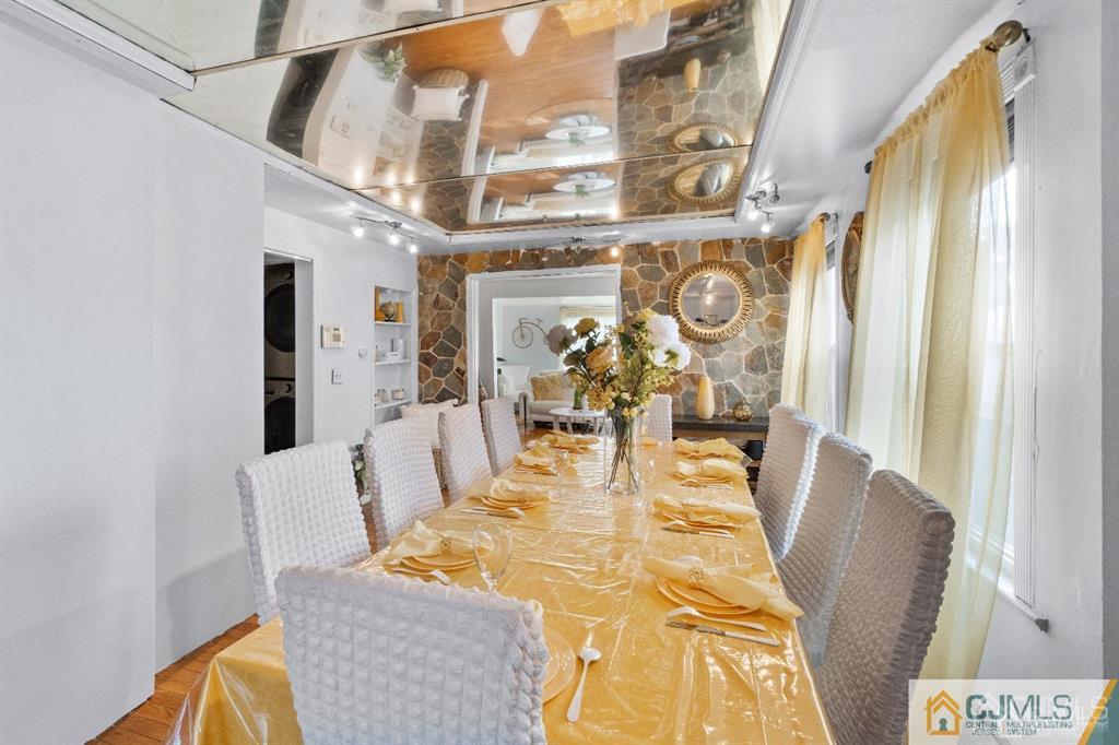 701 Spruce Street Roselle, NJ 07203 - Photo 13 of 28 a view of a dining room with furniture and a chandelier
