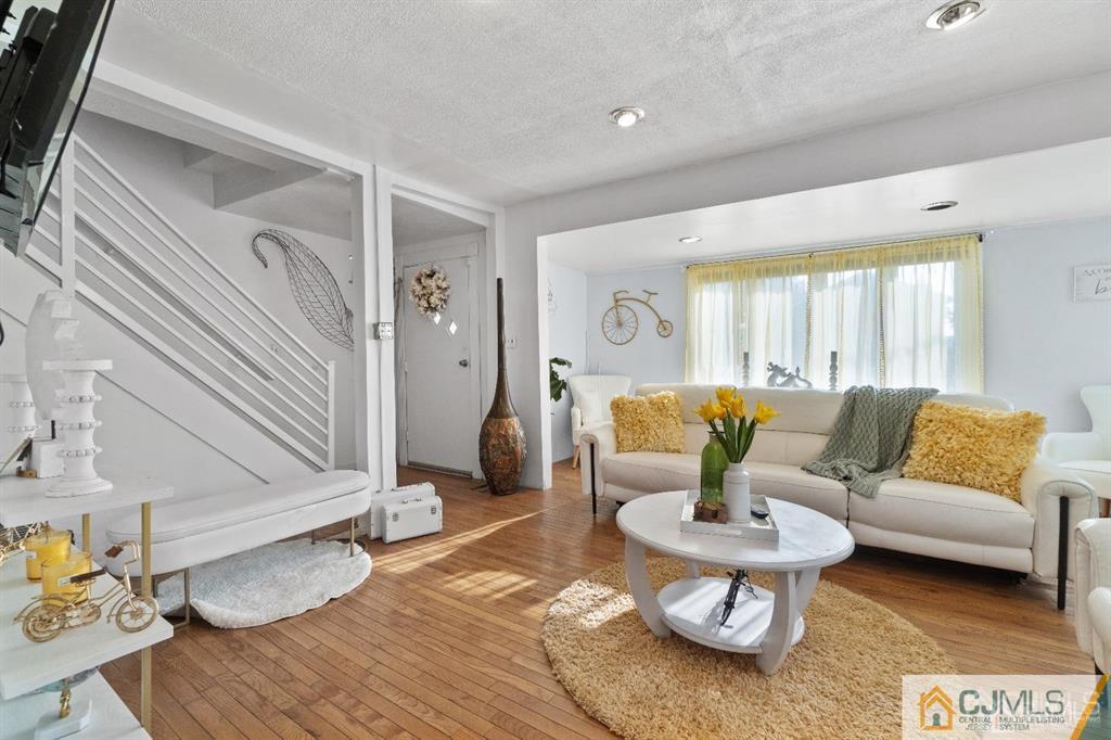 701 Spruce Street Roselle, NJ 07203 - Photo 17 of 28 a living room with furniture and wooden floor