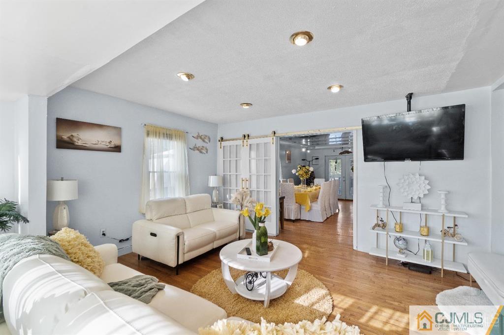 701 Spruce Street Roselle, NJ 07203 - Photo 19 of 28 a living room with furniture and a flat screen tv