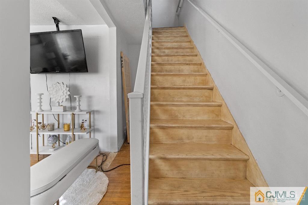 701 Spruce Street Roselle, NJ 07203 - Photo 20 of 28 a view of a livingroom with furniture and staircase