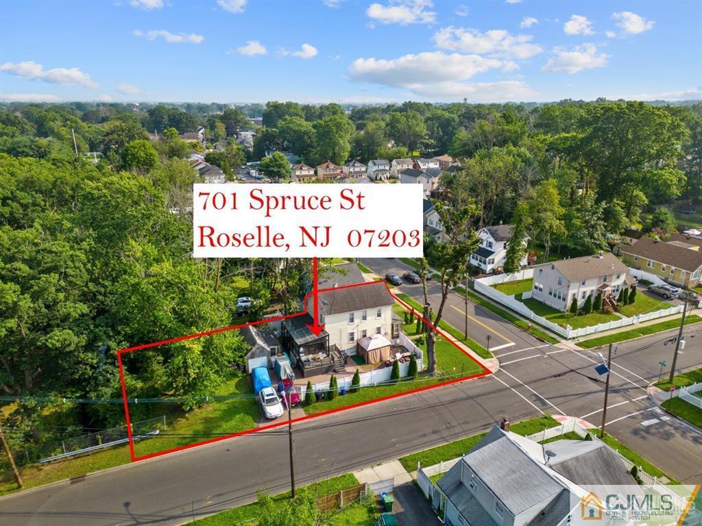701 Spruce Street Roselle, NJ 07203 - Photo 2 of 28 a view of a street with sitting area