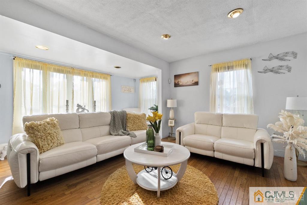 701 Spruce Street Roselle, NJ 07203 - Photo 21 of 28 a living room with furniture and a wooden floor