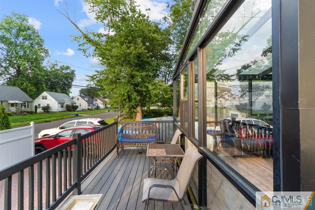 701 Spruce Street Roselle, NJ 07203 - Photo 6 of 28 a view of a balcony with wooden floor