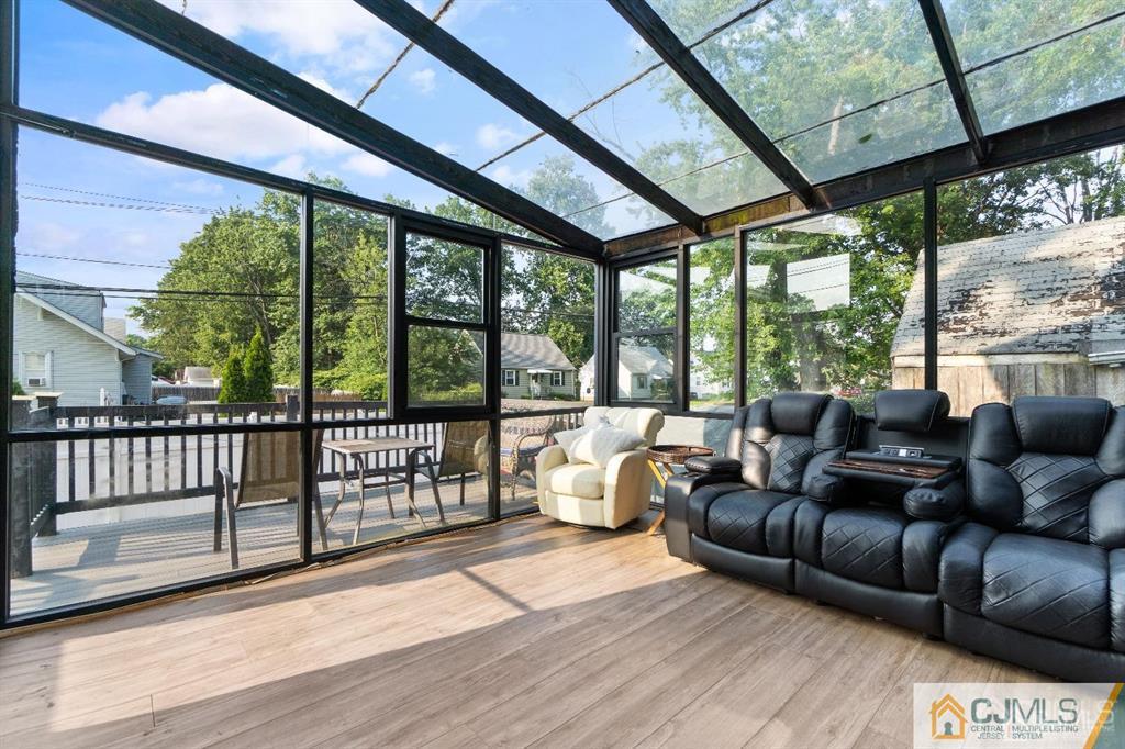 701 Spruce Street Roselle, NJ 07203 - Photo 8 of 28 a living room with furniture and a floor to ceiling window