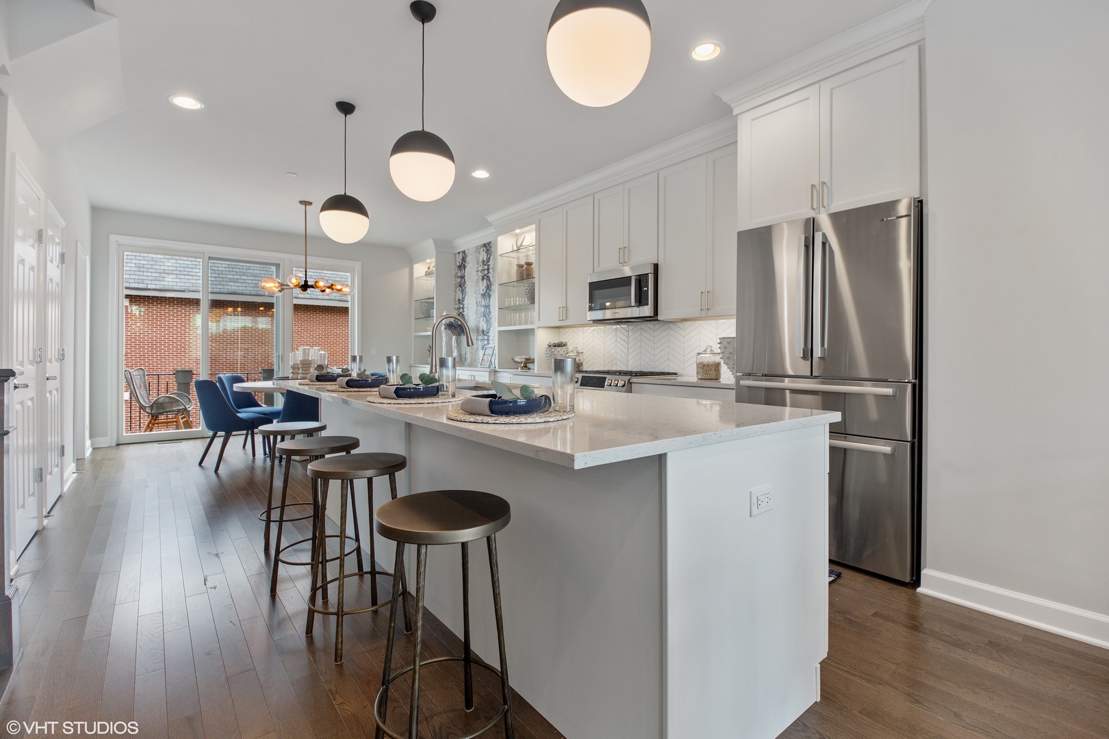 1281 Shermer Road Northbrook, IL 60062 - Photo 7 of 23 a kitchen with table chairs cabinets and stainless steel appliances