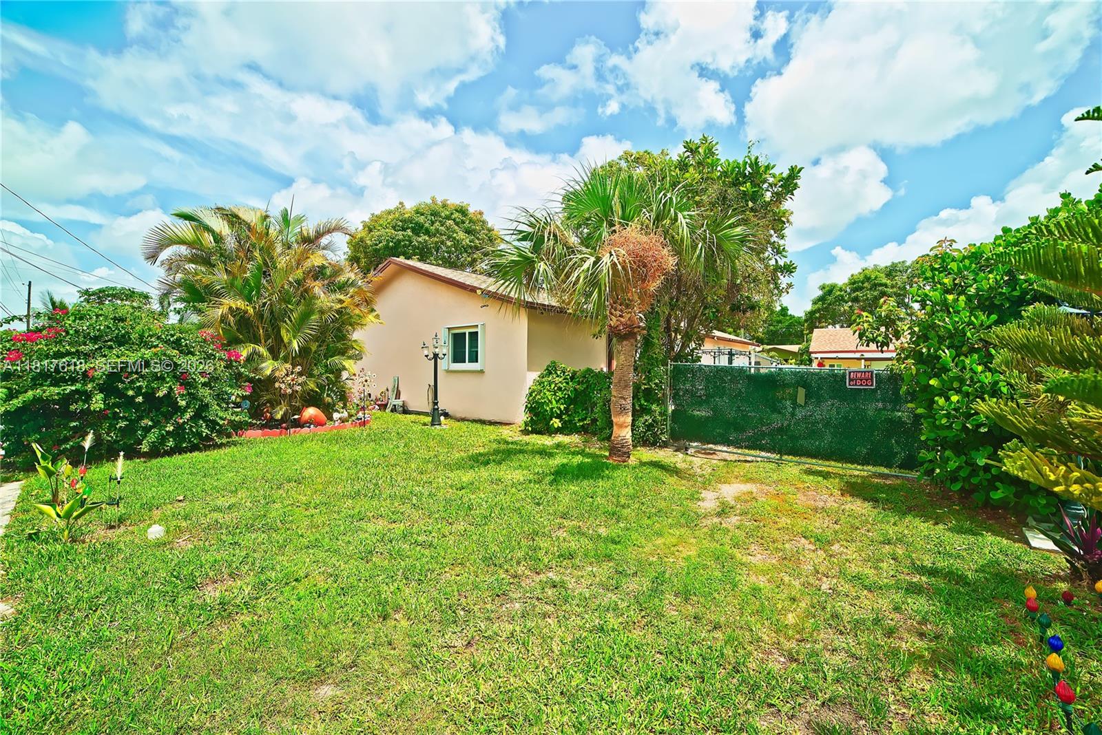 10471 Southwest 174th Terrace Miami, FL 33157 - Photo 1 of 23 a house view with a garden space