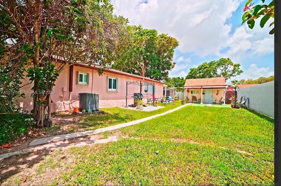 10471 Southwest 174th Terrace Miami, FL 33157 - Photo 11 of 23 a view of a house with backyard and garden