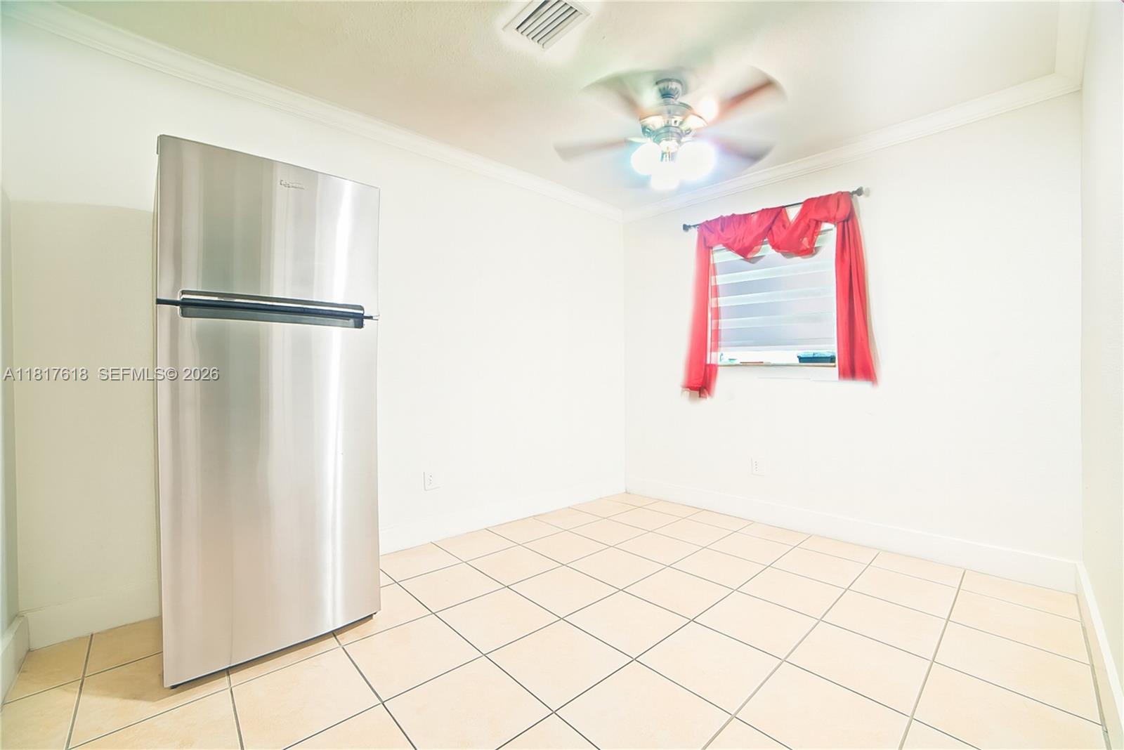 10471 Southwest 174th Terrace Miami, FL 33157 - Photo 19 of 23 a very nice looking room with a potted plant