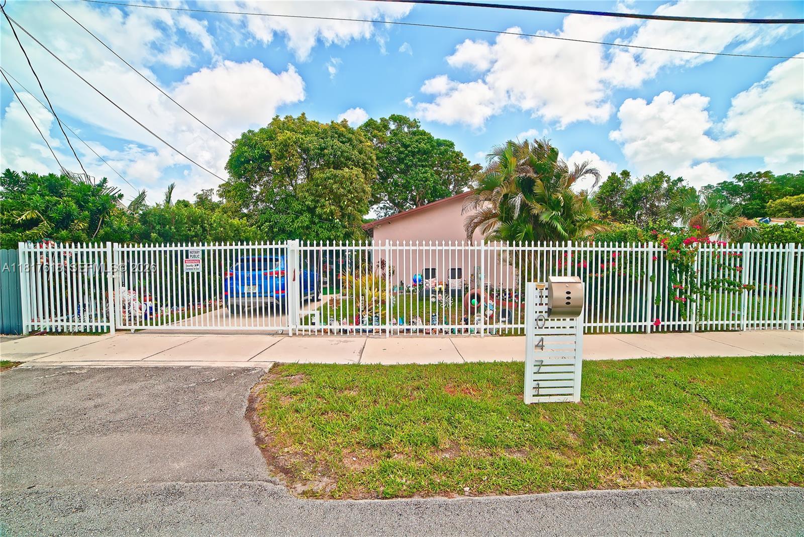 10471 Southwest 174th Terrace Miami, FL 33157 - Photo 2 of 23 a house view with a garden space