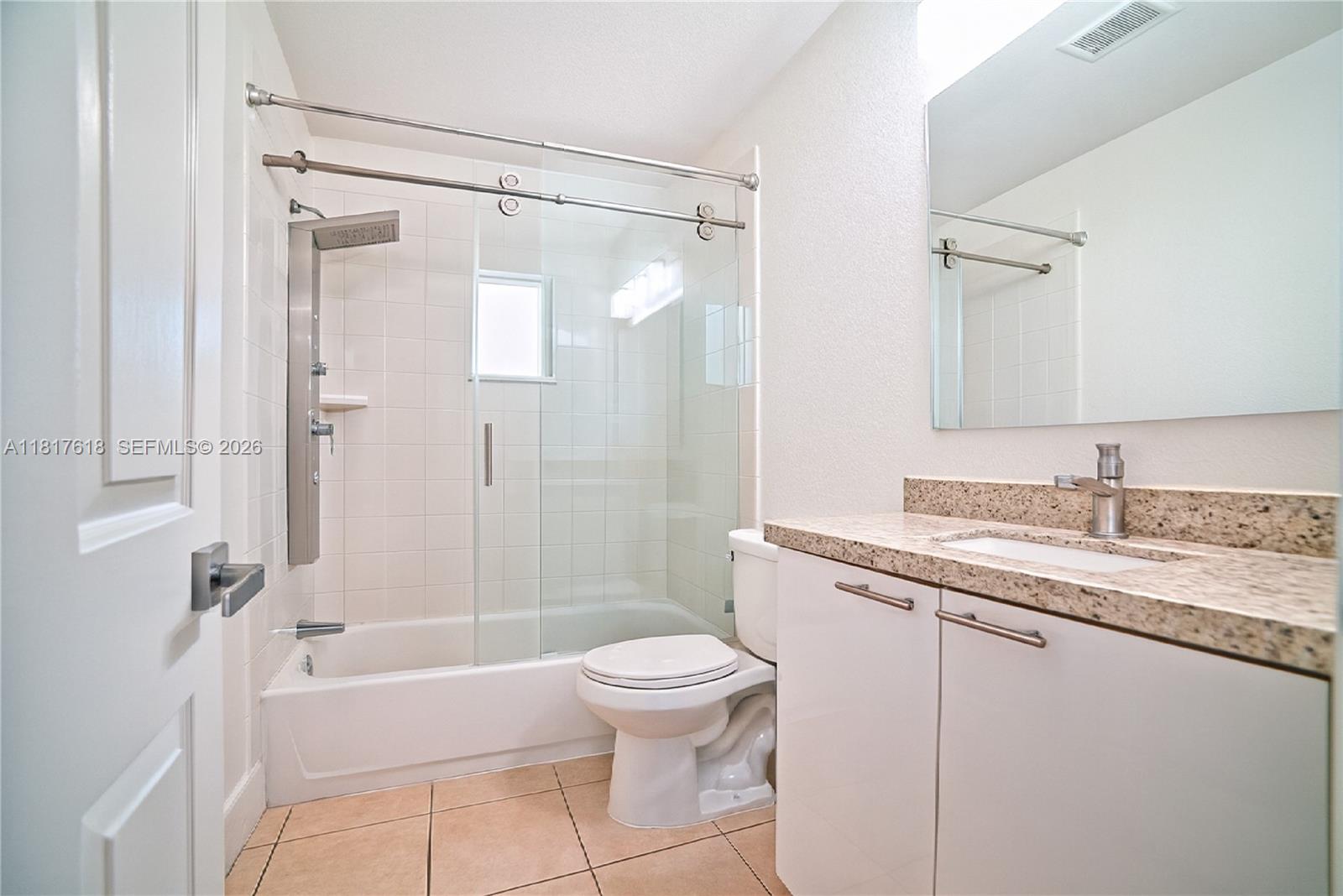 10471 Southwest 174th Terrace Miami, FL 33157 - Photo 9 of 23 a bathroom with a granite countertop sink toilet and shower