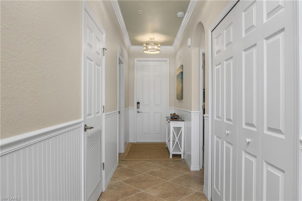 9834 Giaveno Circle, Unit 1746 Naples, FL 34113 - Photo 1 of 41 a view of a hallway