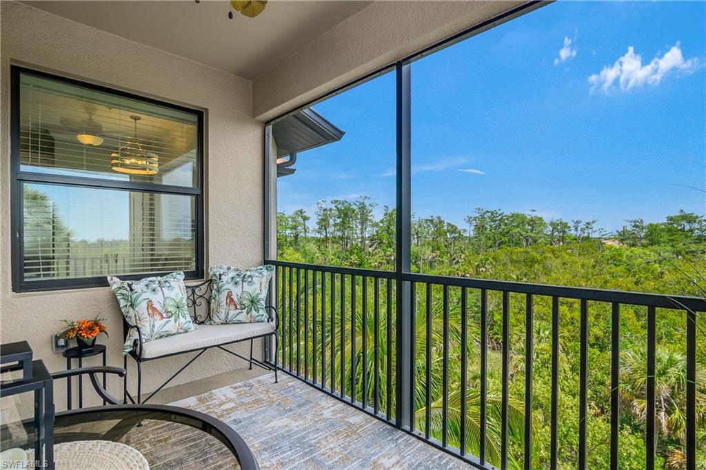 9834 Giaveno Circle, Unit 1746 Naples, FL 34113 - Photo 14 of 41 a view of a chairs and tables in the balcony