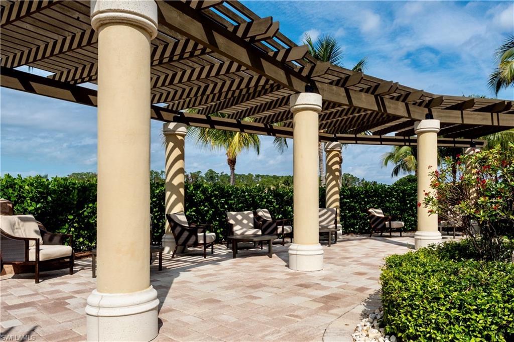 9834 Giaveno Circle, Unit 1746 Naples, FL 34113 - Photo 28 of 41 a view of outdoor space yard and porch
